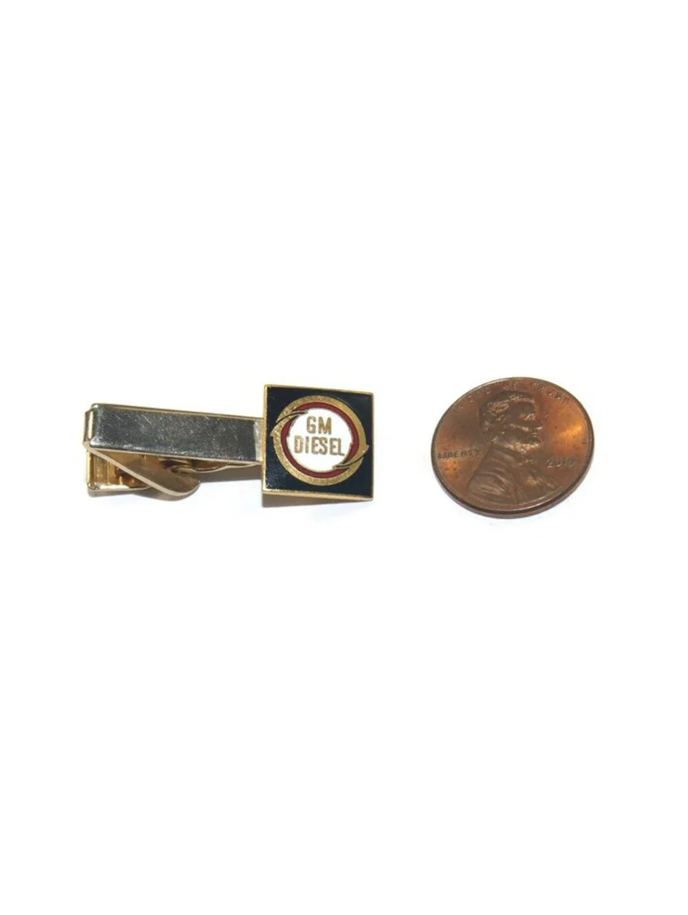 Vintage Gold Tone, Black and White Enamel GM Diesel Logo Tie Clip.